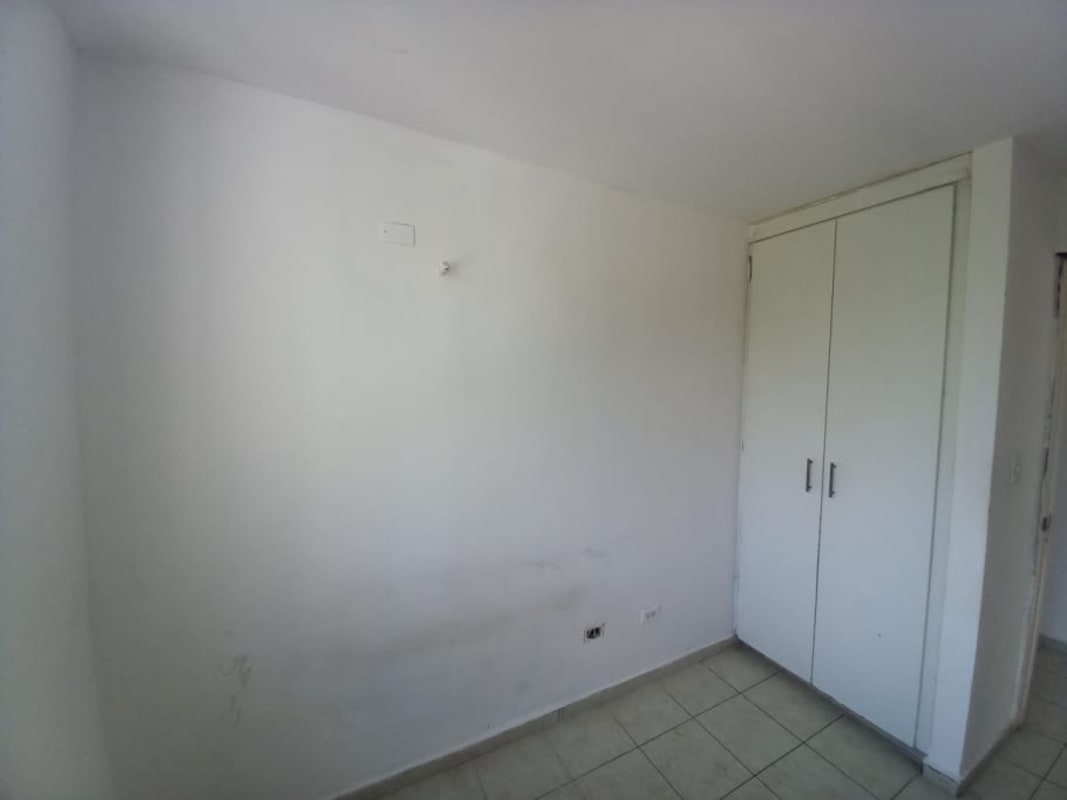 Minimalist bedroom with tile floor closet window in PH Mallorca Park Gardens II