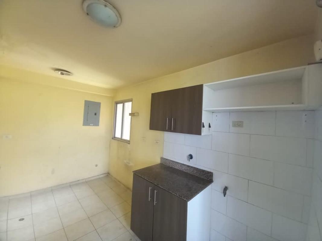 Bedroom with tile floor and window in PH Mallorca Park Gardens II San Miguelito