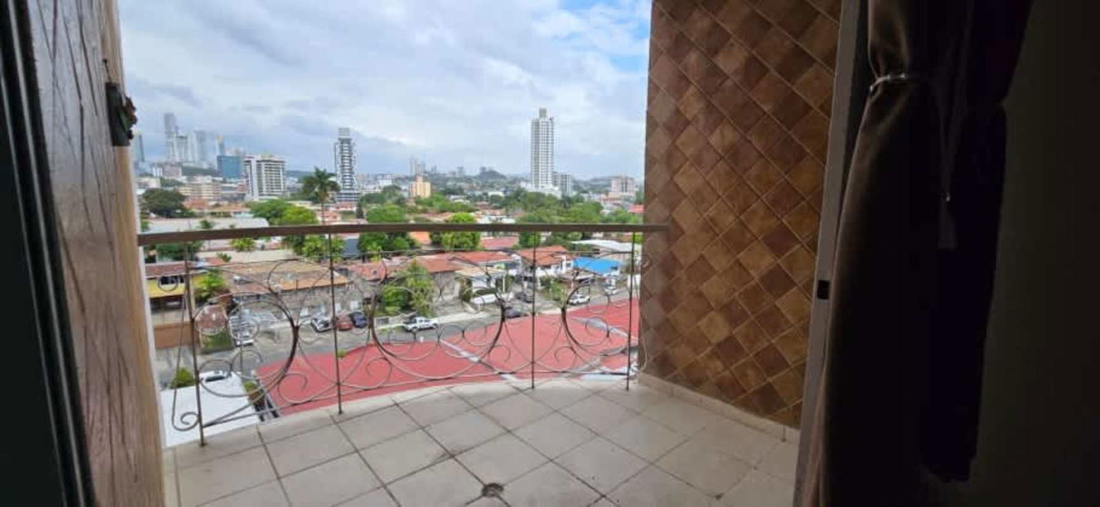 Balcony with decorative tiles and city skyline vista at PH El Carmen Panama