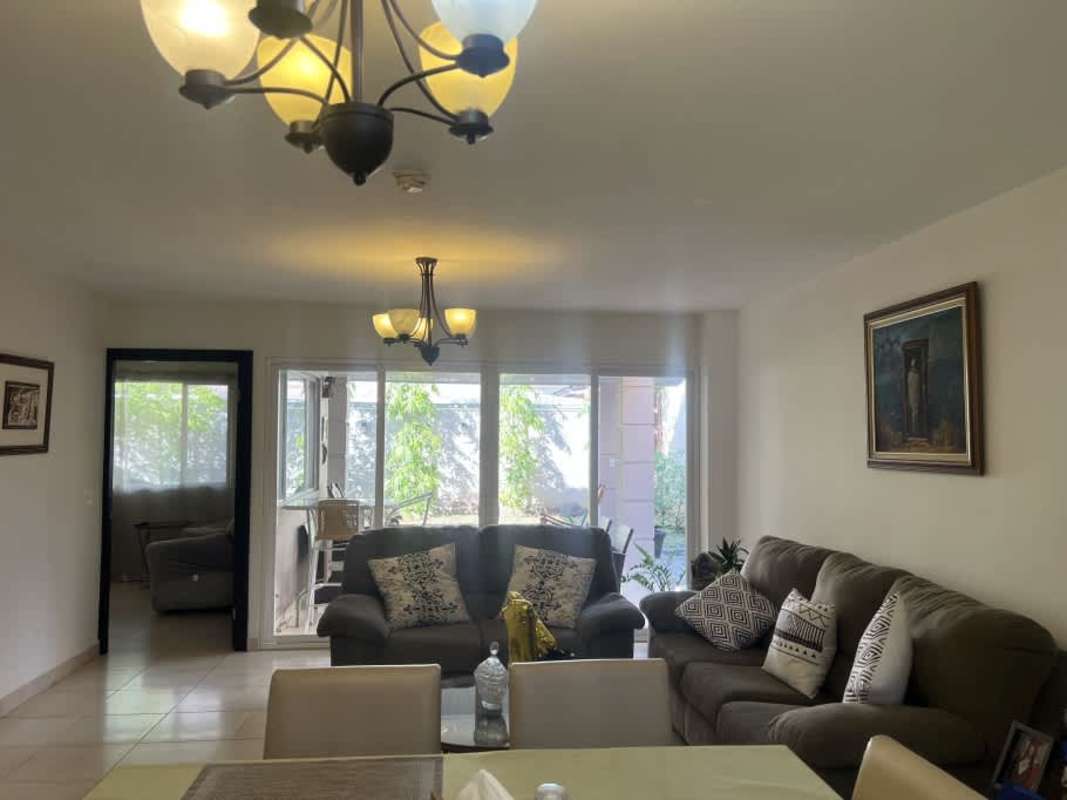 Kitchen with granite countertops and ample cabinetry in Villas Tiber Brisas del Golf Panama