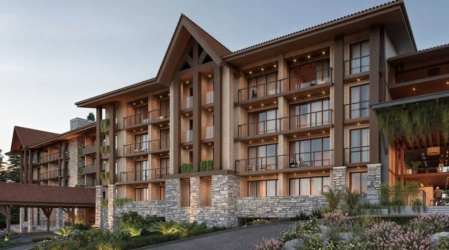 Multi-story mountain condo with balconies, stone and wood facade in Boquete