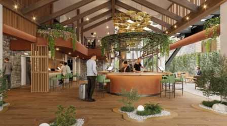 Modern rustic lobby with circular bar, hanging plants, wooden beams in Boquete mountain resort