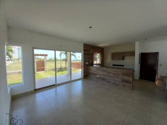 Living room with tiled floor and natural light sliding doors in Fontanela del Mar San Carlos Panama