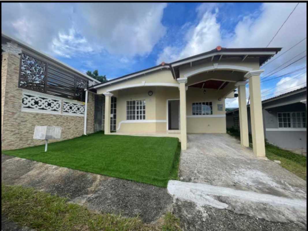 Suburban street with fenced houses and greenery in Cerro Viento Panama for sale