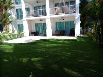 Exterior view two-story PH Bijao Residences beachfront building with balconies and gardens