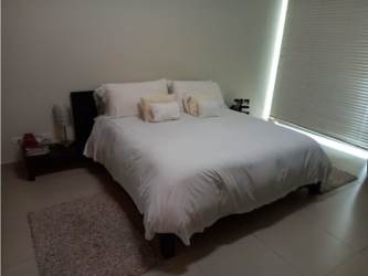 Modern master bedroom with queen bed and ocean views Bijao Beach Panama