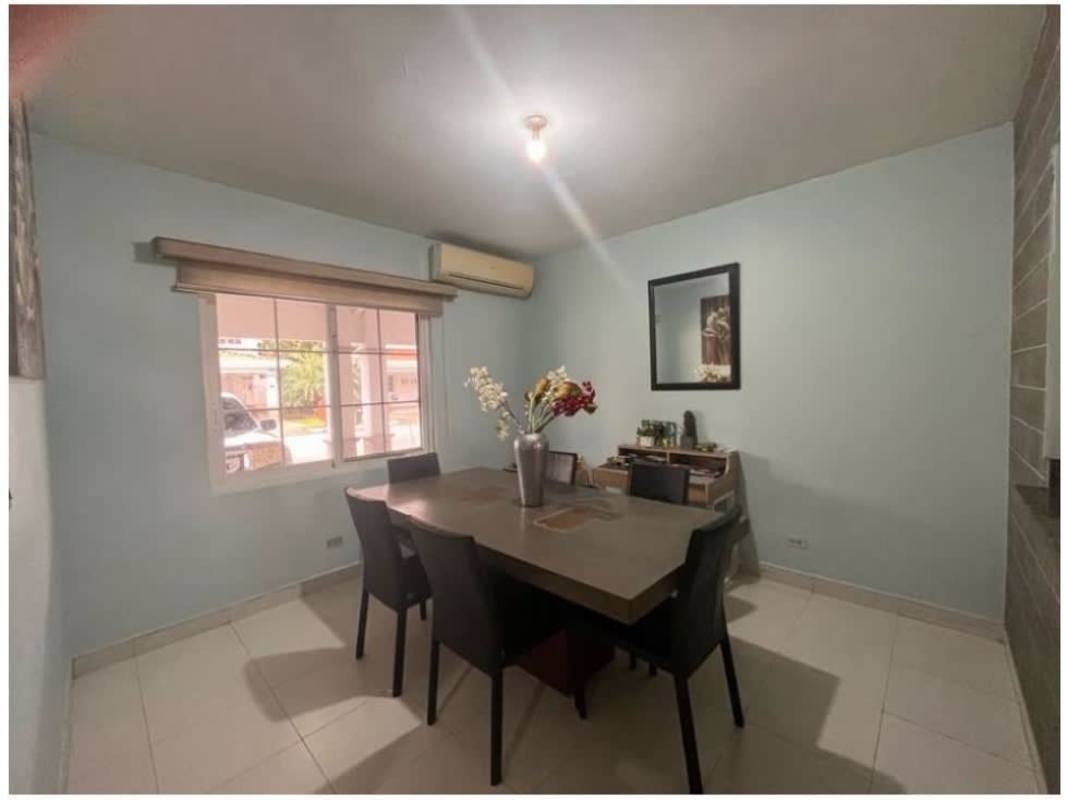 Kitchen with granite counters, wood cabinets, built-in appliances at PH Quintas de Versalles Costa Sur Panama City