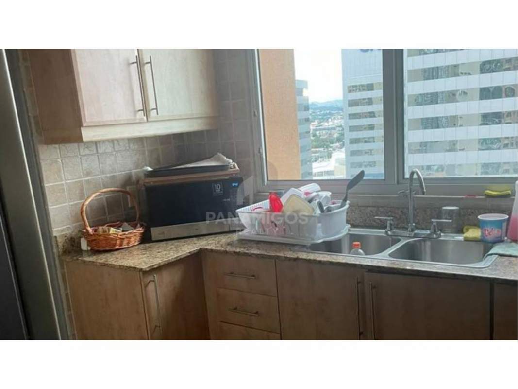 Large bedroom with accent wallpaper, upholstered bed in Mystic Point Punta Pacífica Panama