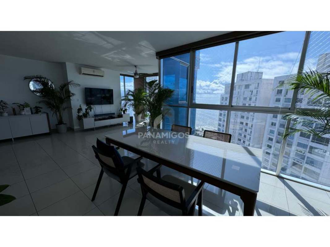 Open concept living dining area with big windows city view PH Waterfalls Coco del Mar