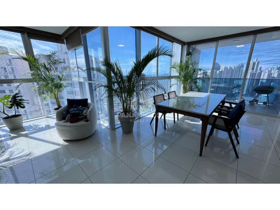 Dining area with panoramic windows ocean view modern condo Coco del Mar Panama
