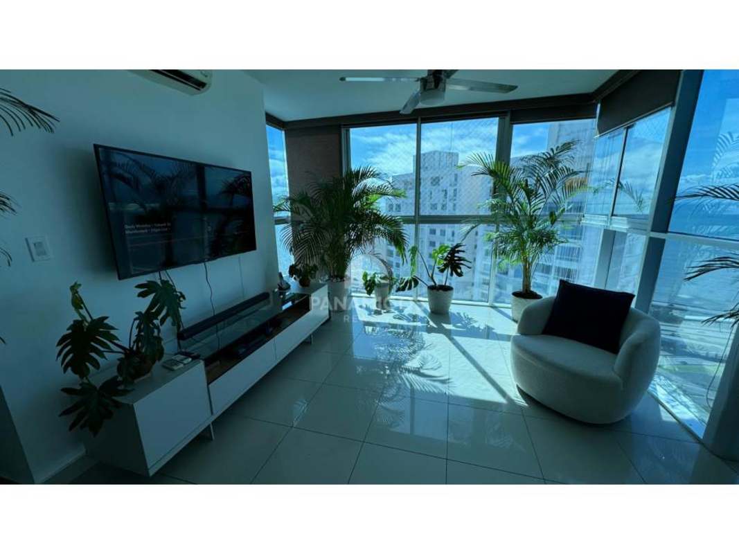 Living room with panoramic windows city view modern condo Coco del Mar Panama