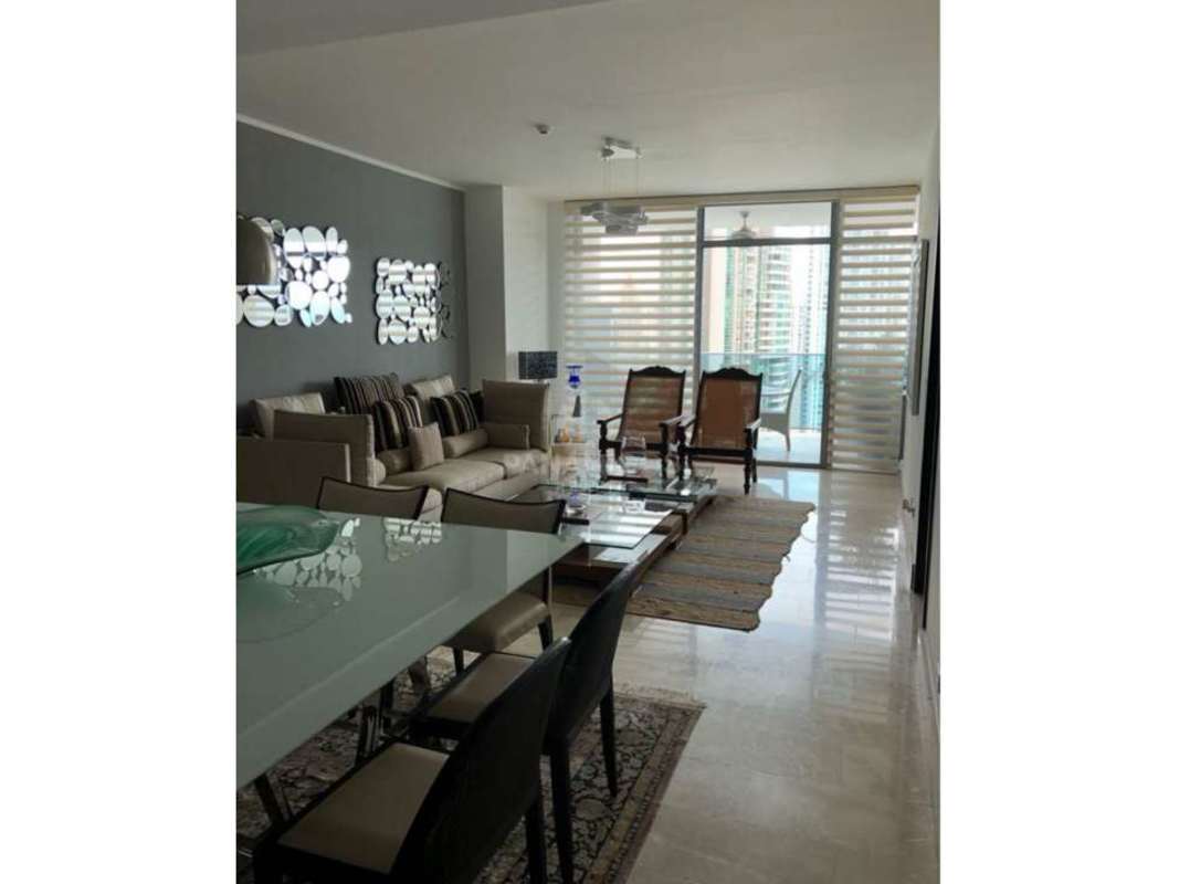 Open-plan living and dining area with ocean views at PH Grand Tower Punta Pacifica Panama City