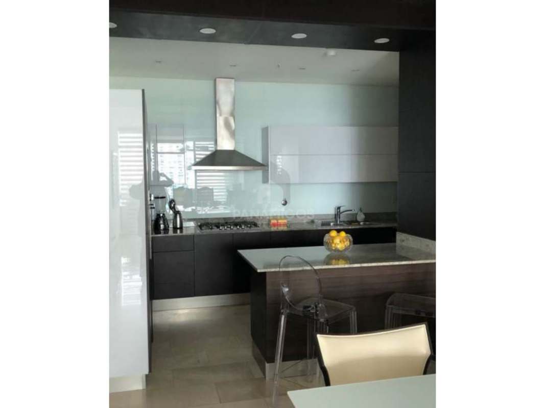Modern kitchen with granite island, stainless appliances at PH Grand Tower Punta Pacifica Panama