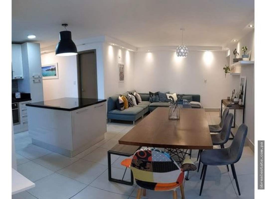 Open concept kitchen with island and living dining area in PH Park City Obarrio Panama City