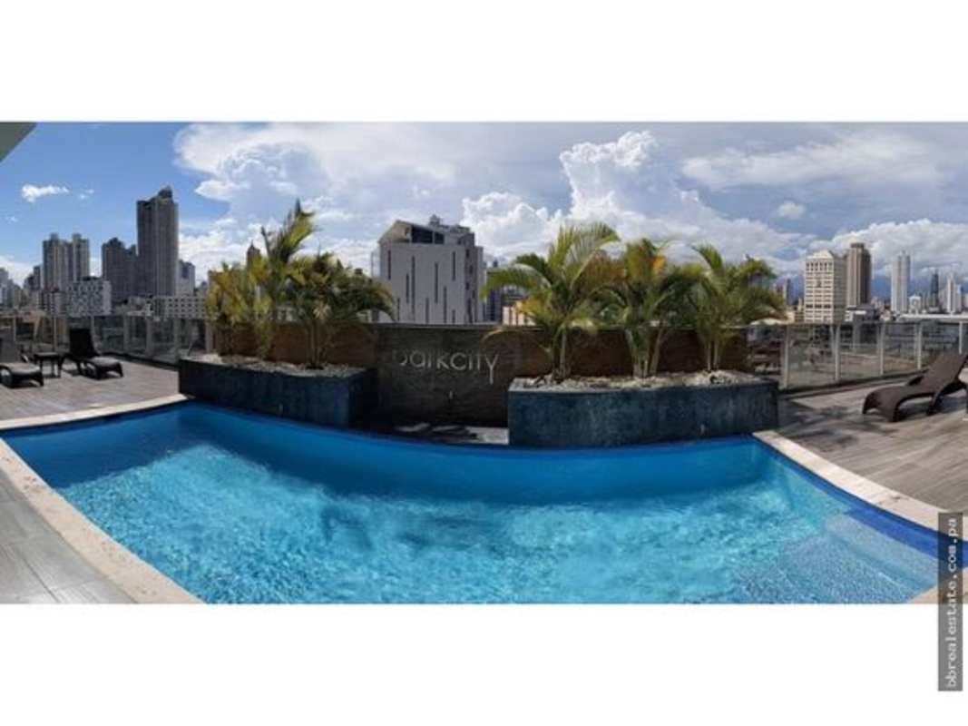 Infinity rooftop pool with panoramic skyline views and glass railing at PH Park City Obarrio Panama
