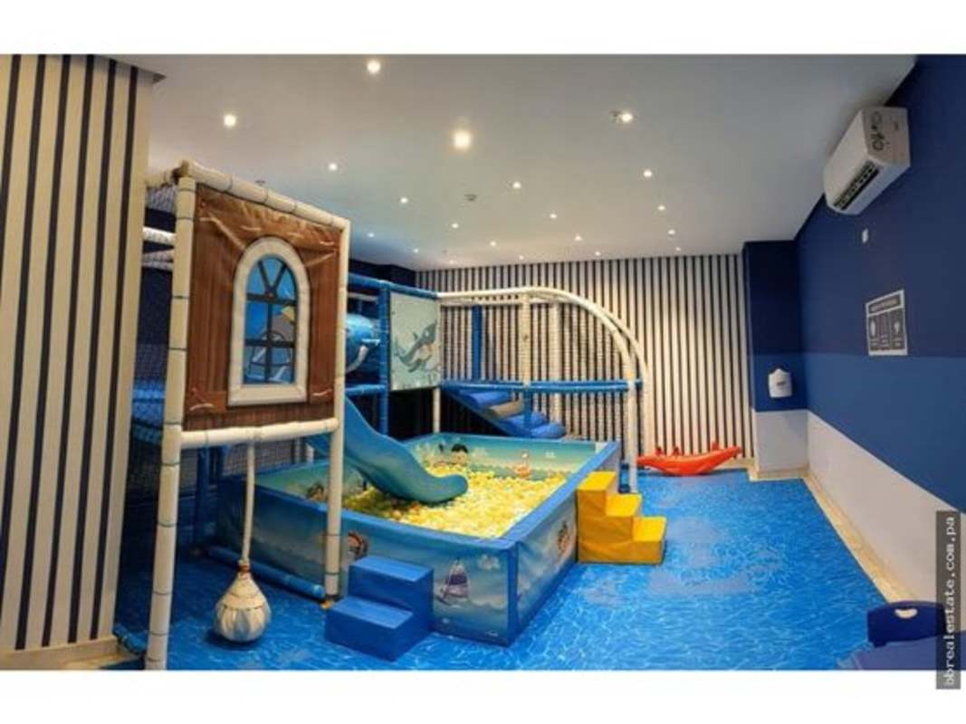 Nautical-themed children's playroom with slides and soft zones at PH Park City Obarrio Panama