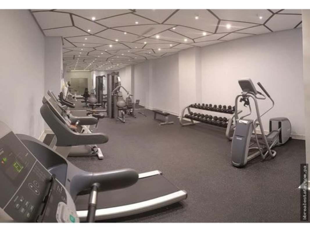 Fully equipped indoor gym with cardio and weights at PH Park City in Obarrio Panama City