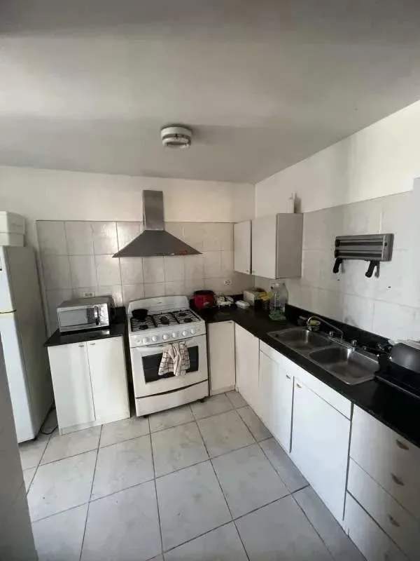Secondary bedroom with Juliet balcony, closet, tile floors, and AC in Panama