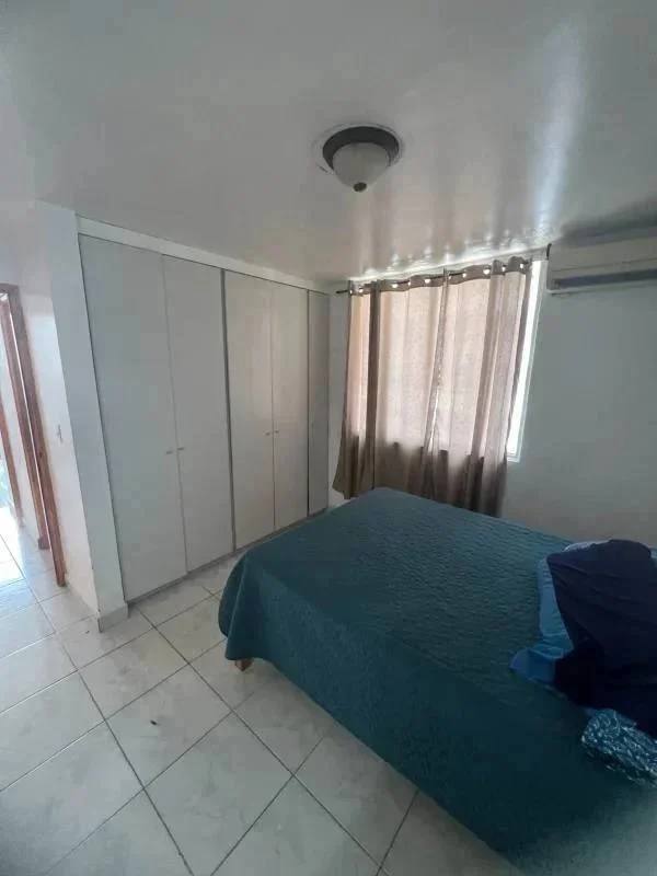Bedroom with closet, balcony access, tile floors, and AC in PH Brisas de San Fernando Panama City