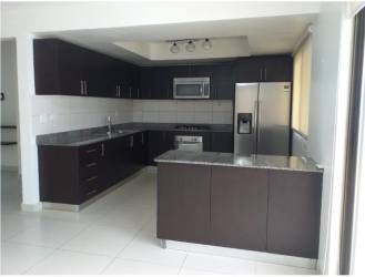 Master bedroom with balcony and walk-in closet in Woodlands Panama Pacifico house