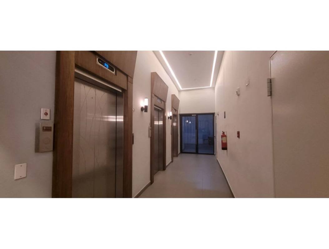 Living room with large glass sliding door to balcony, natural light, PH Mi Condado VY Condado del Rey