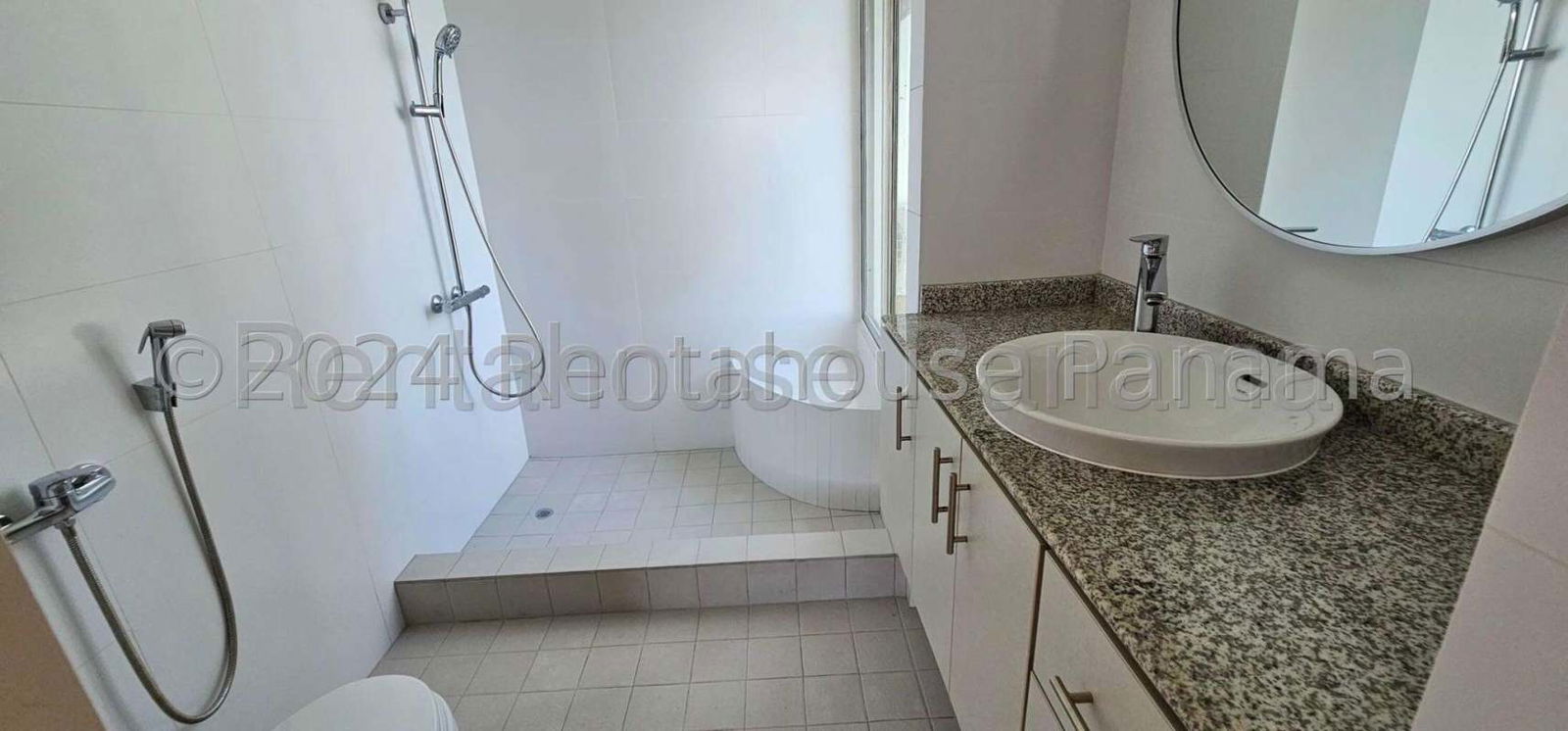 Modern kitchen with granite counters and white cabinets Coconut Grove Tower Panama