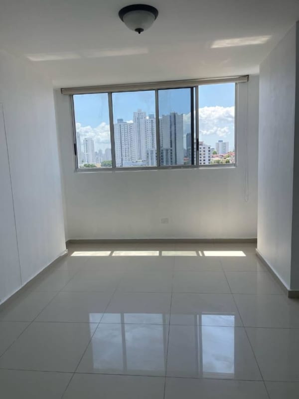 Living room with tiled floor, large windows, ceiling fan and city view in PH City Towers Panama