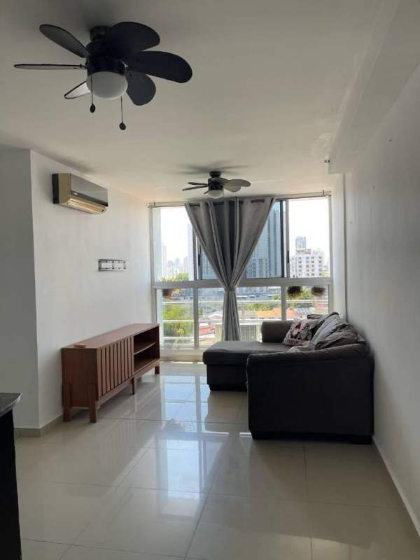 Living and dining space with windows and city skyline view PH City Towers Panama