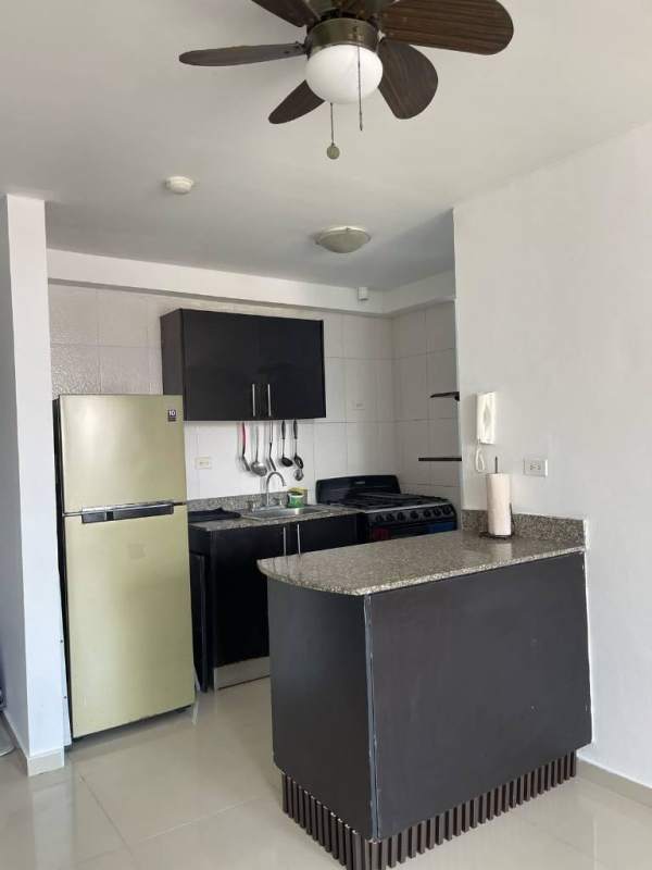 Kitchen with granite counter, appliances and tiled backsplash in PH City Towers rental Panama