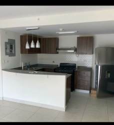 Modern kitchen with breakfast bar, granite counters and appliances PH Midtown Panama Pacifico