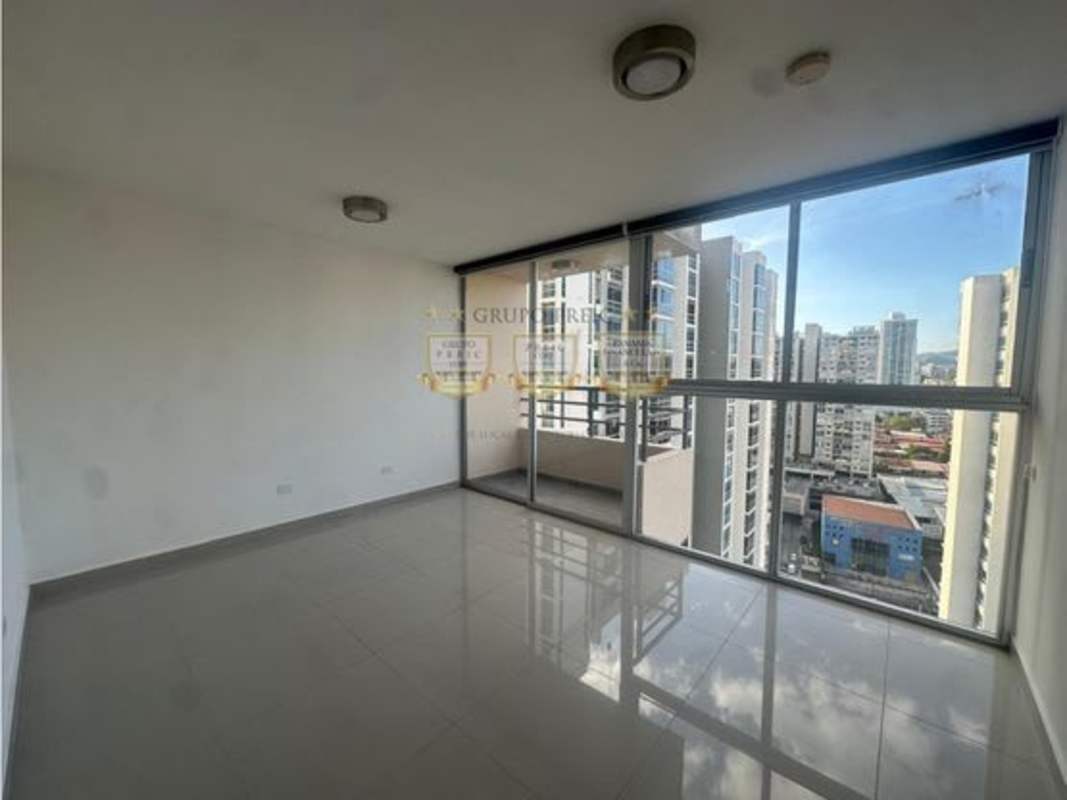 Modern living area with large panoramic windows and balcony at PH Sky Park apartment