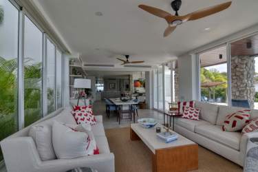 Modern dining room in beachfront villa with panoramic windows in Chumico Redondo Panama