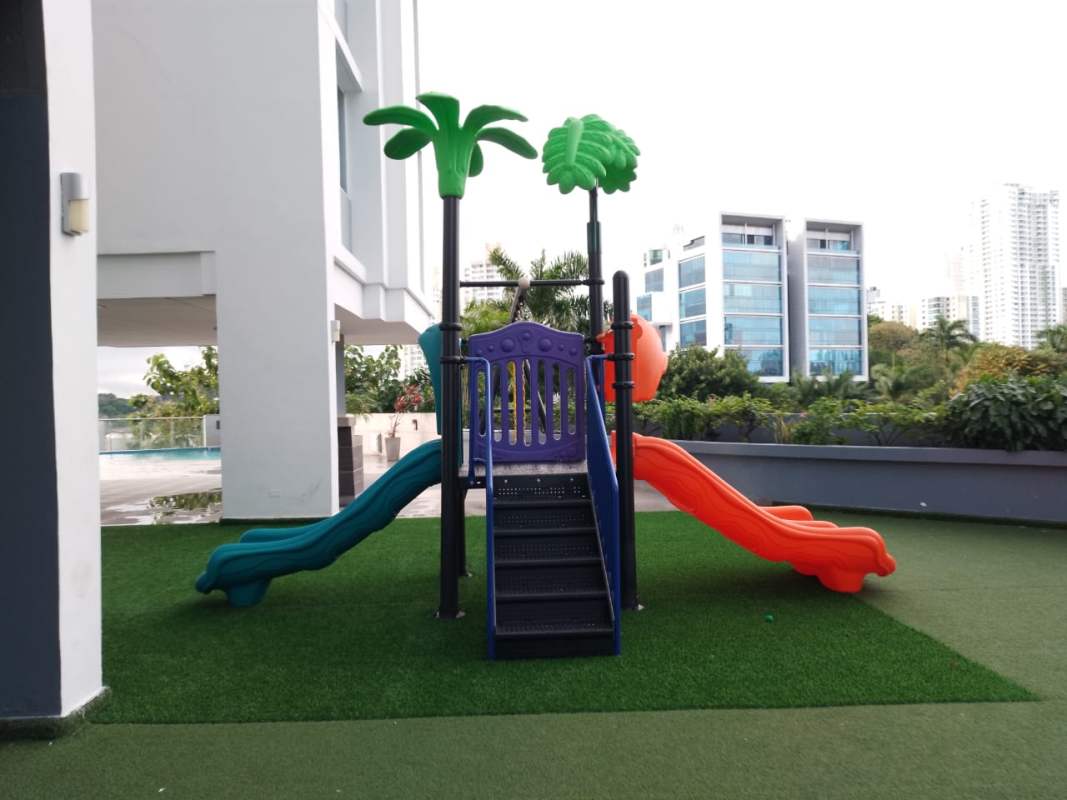Outdoor children's play area with slides at PH Mont Royale Panama City