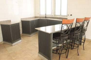 Modern kitchen with granite counters, breakfast bar, ample windows in mountain house Las Nubes El Valle