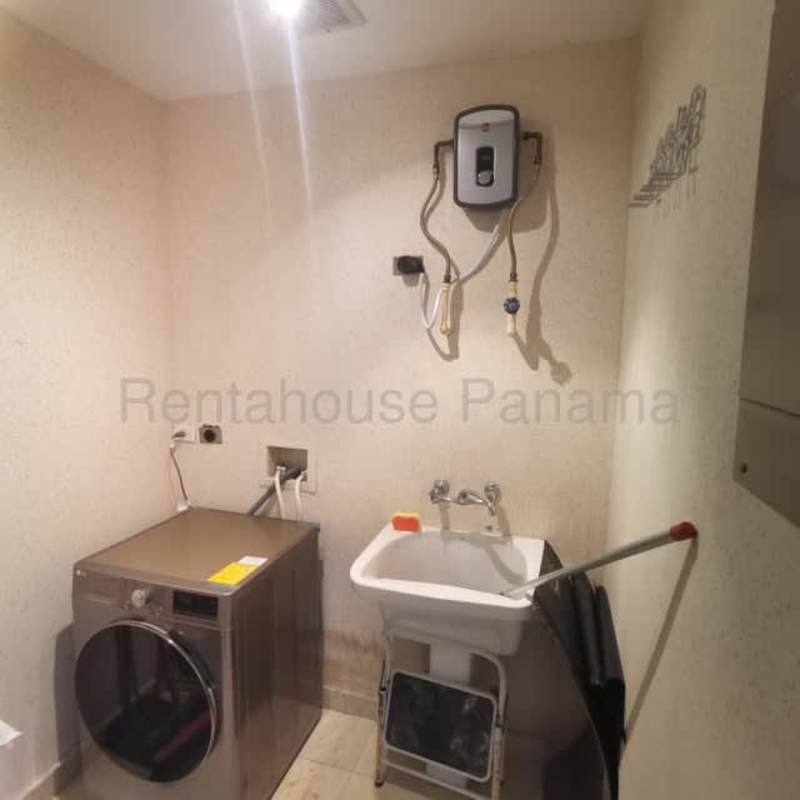 Furnished master bedroom with large window natural light ocean view and walk-in closet in PH Riverside Panama