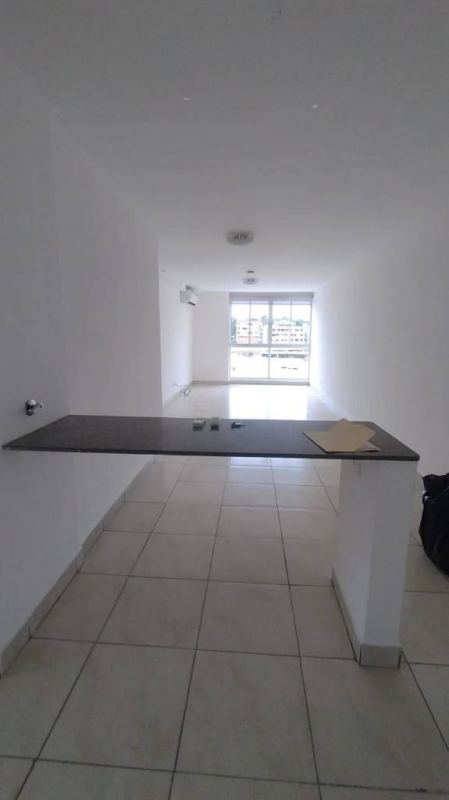 Modern bathroom with tiled walls and walk-in shower in bargain Panama City apartment