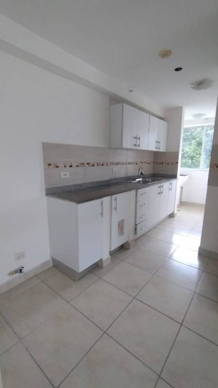 Kitchen with granite countertop and tile backsplash in apartment for sale near 12 de Octubre Metro Panama City