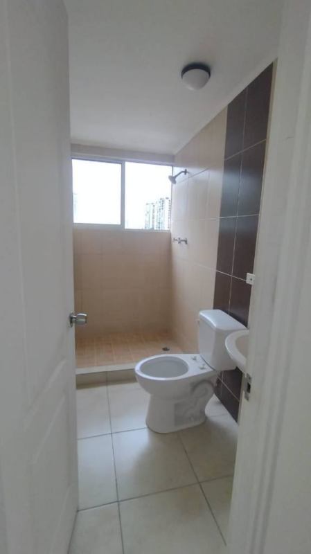 Bedroom in Hato Pintado apartment with city view window and closet Panama City