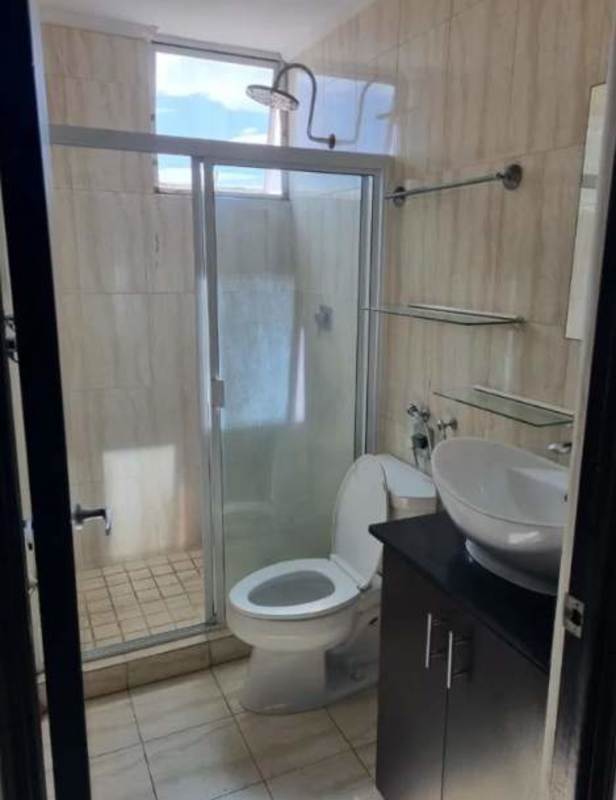 Bathroom with glass shower, vessel sink, and natural light in PH Park Lane Tower Panama