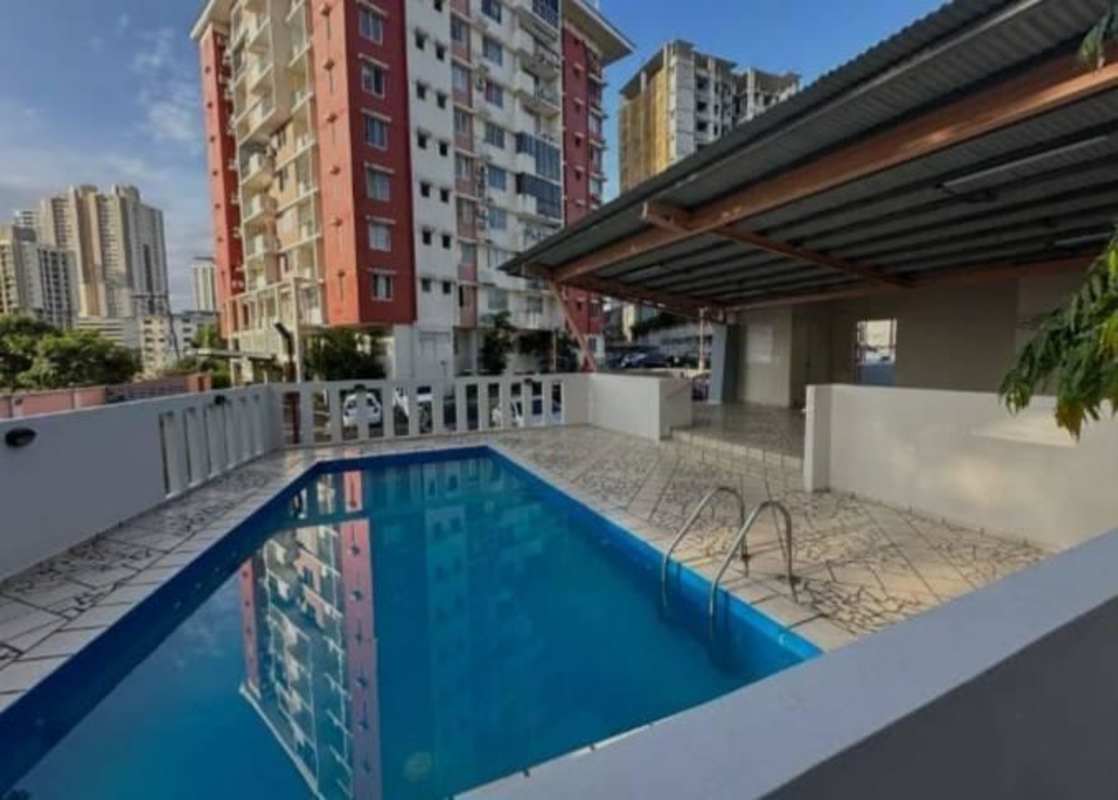 Outdoor swimming pool with tiled deck in PH Altos de la Colina 12 de Octubre Panama City