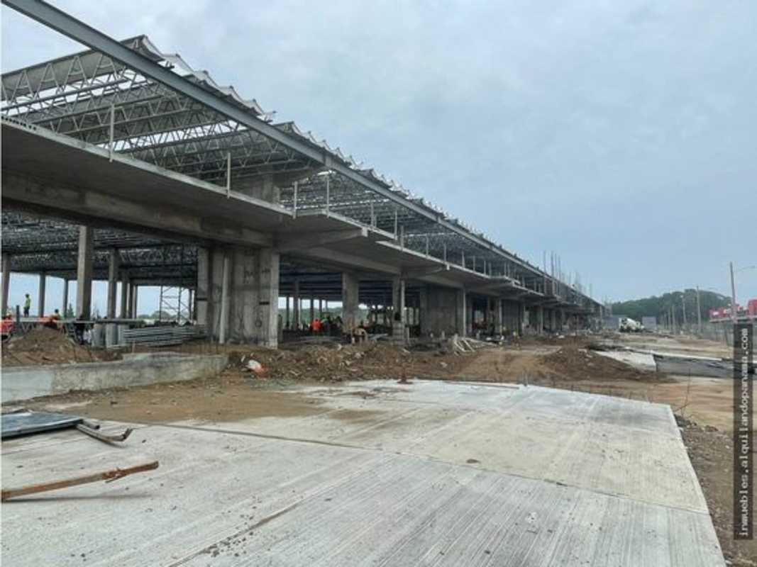 Large unfinished commercial property site with open framework and concrete pavement in Tocumen Panama
