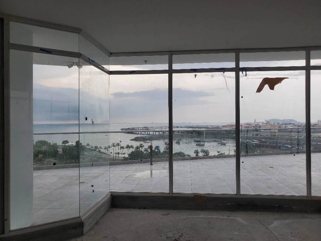 Glass storefront of grey shell commercial space overlooking Cinta Costera in PH The Sands Panama City