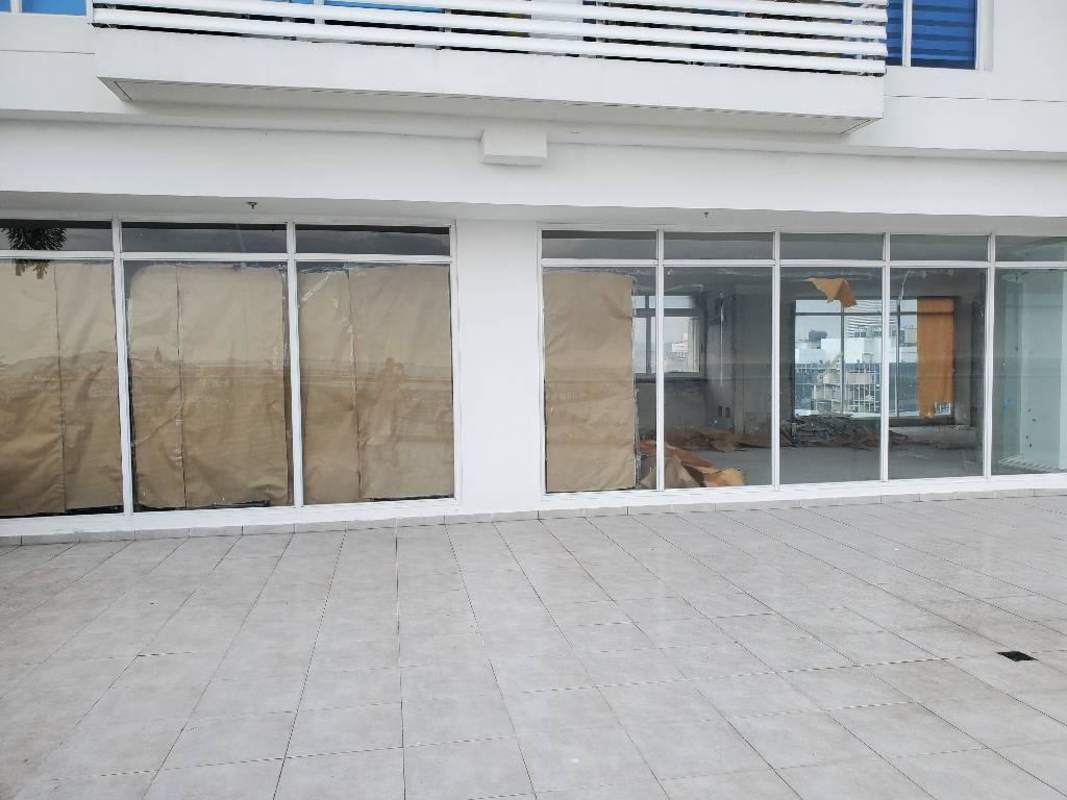 Spacious unfinished interior with panoramic ocean view glass windows at PH The Sands Mall Panama City