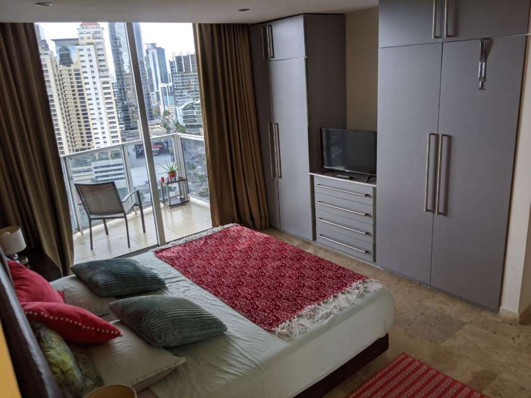 Modern bedroom with balcony city views, large windows, built-in closet in PH Denovo Obarrio Panama