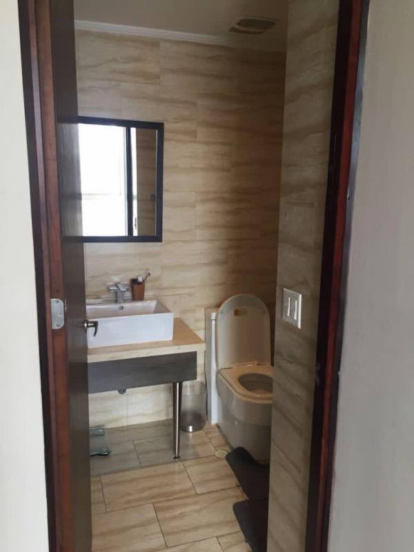 Elegant bedroom with padded headboard city skyline balcony in PH Denovo Obarrio Panama