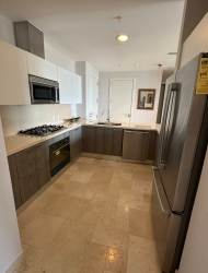 Contemporary kitchen with white cabinets, stone counters, stainless appliances Puntarenas Buenaventura Panama