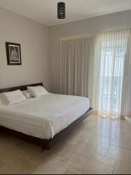 Dining room with glass table ocean views balcony sliding door Buenaventura Panama