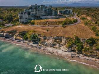 Aerial shot of oceanfront property in Punta Caelo with coastal cliffs and beach