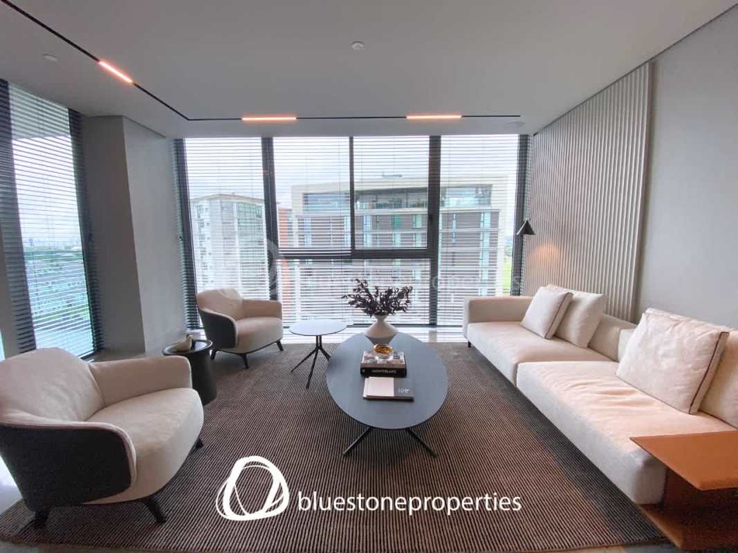 Contemporary apartment kitchen with marble island and built-in appliances in Santa María Panama