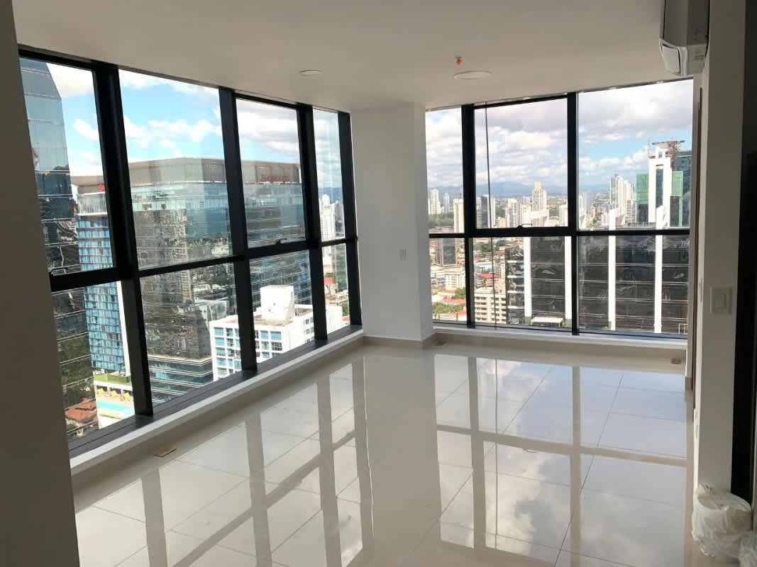 Living space with skyline city views through full glass windows PH Downtown Panama